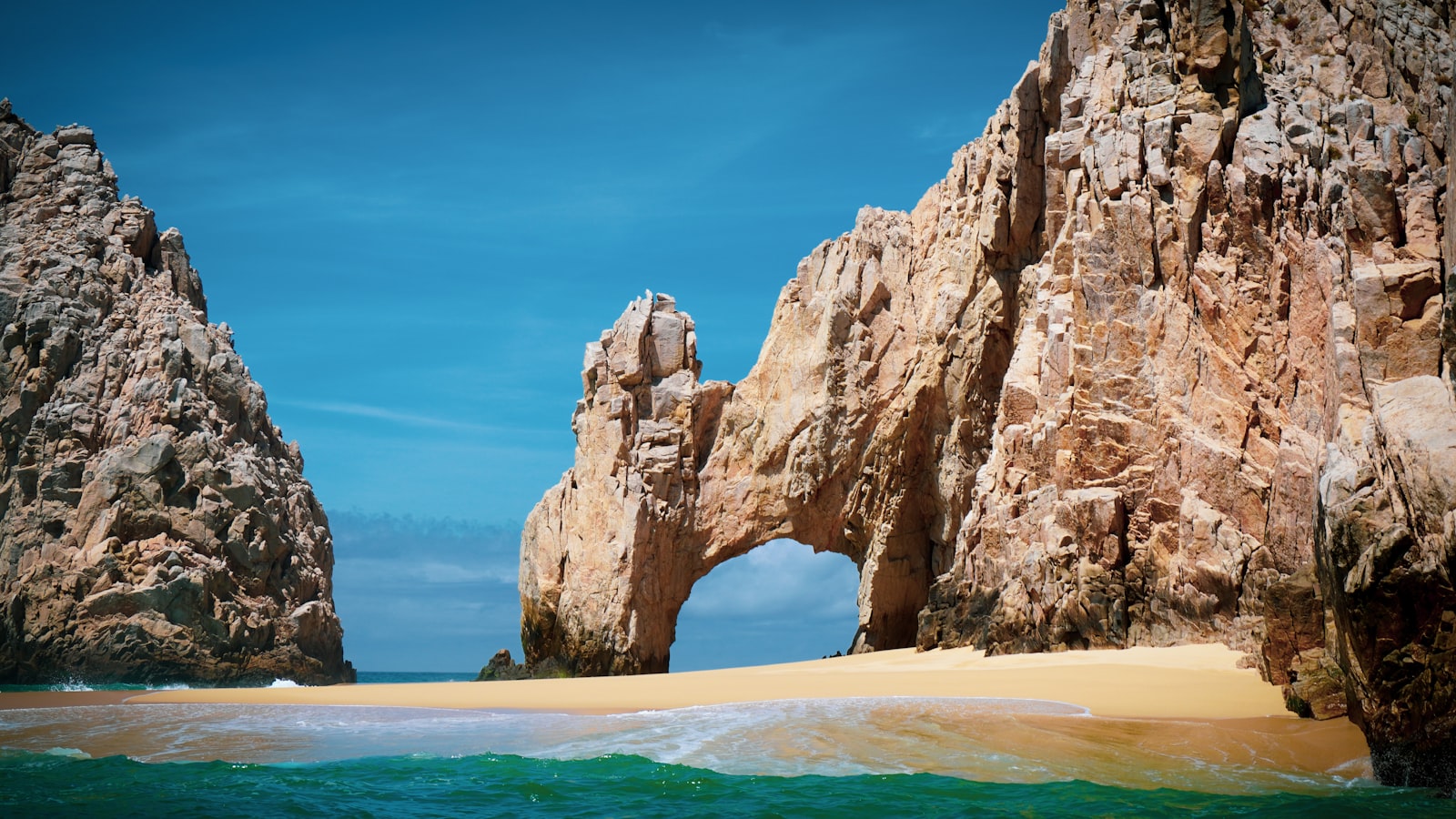 The El Arco rock arch rising from the sea at the tip of the Baja peninsula