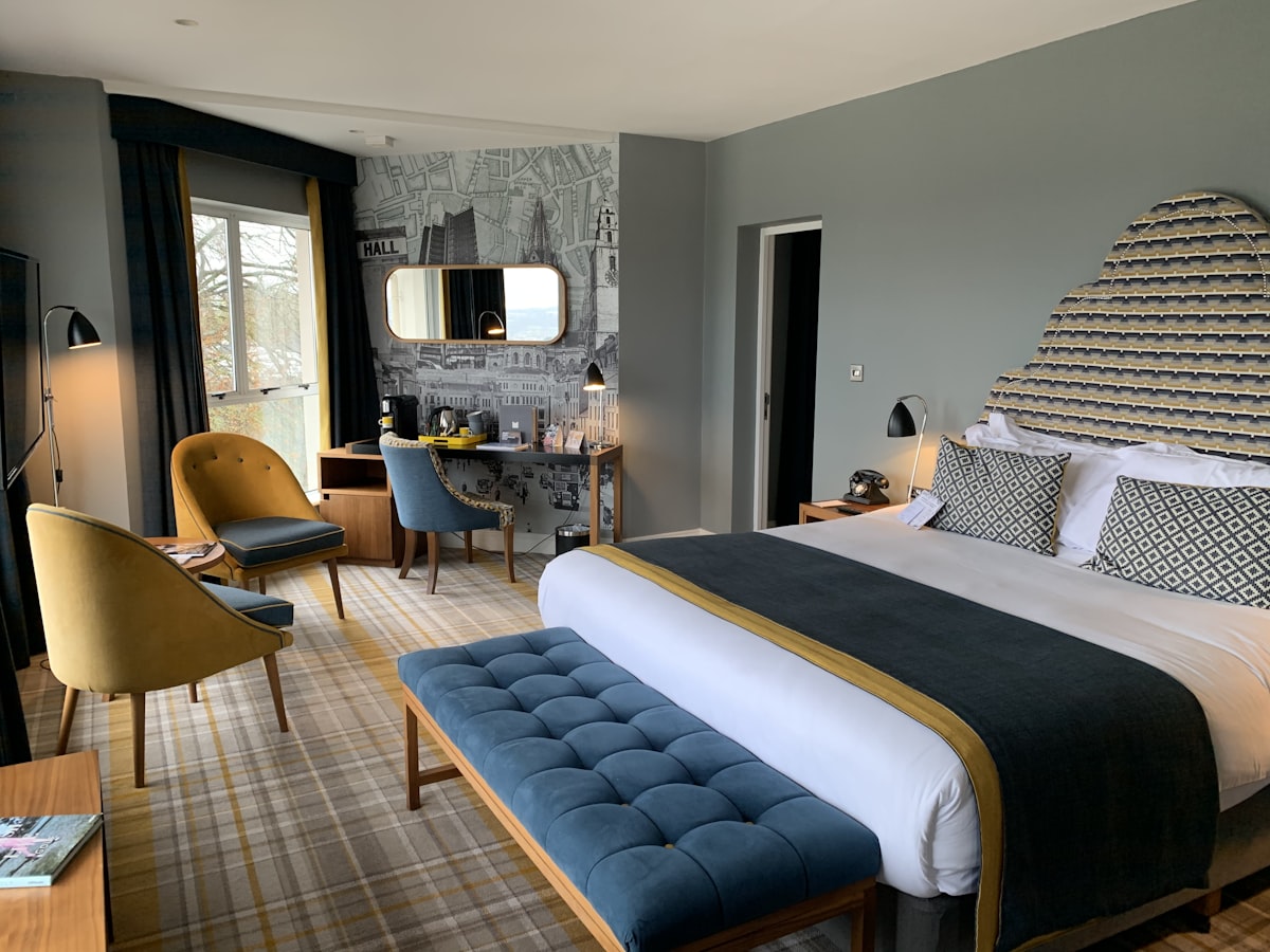 A hotel room with a separated sitting area